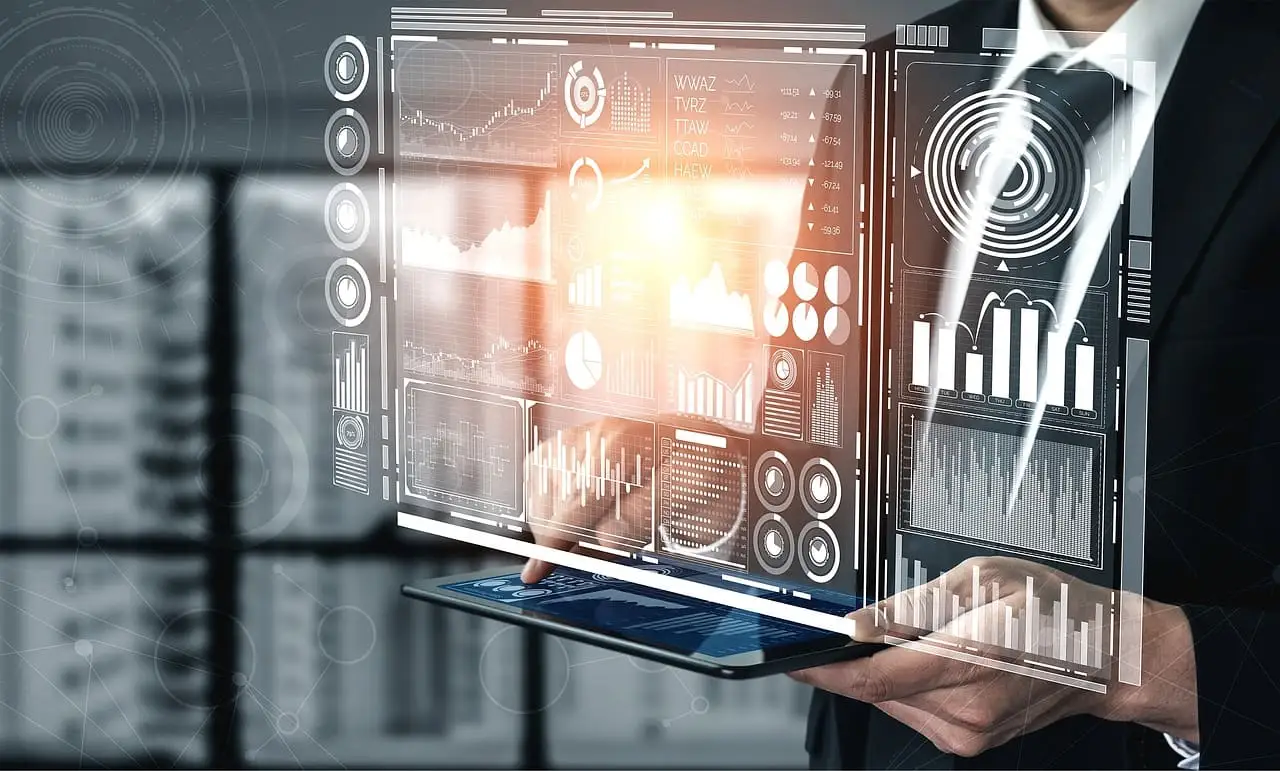 Businessman viewing procurement analytics dashboards projected above a tablet